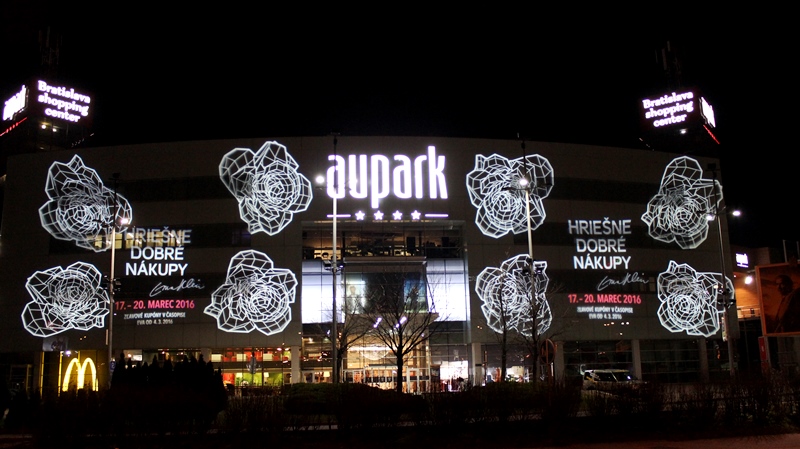 BUILDING PROJECTION, indoor and outdoor light advertising, projected navigation and safety signs, floor marking, light decoration,  illumination architecture, PROFESSIONAL LIGHTNING, Eva Klein, hriešne dobré nákupy aupark bratislava, light projection on the building facade of the shopping center   