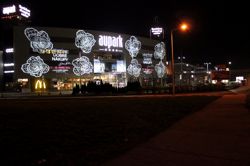 BUILDING PROJECTION, indoor and outdoor light advertising, projected navigation and safety signs, floor marking, light decoration,  illumination architecture, PROFESSIONAL LIGHTNING, Eva Klein, hriešne dobré nákupy aupark bratislava, light projection on the building facade of the shopping center